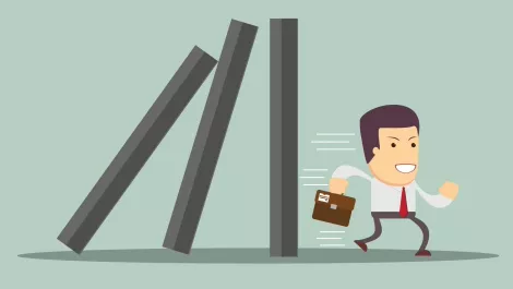 Dominoes falling businessman
