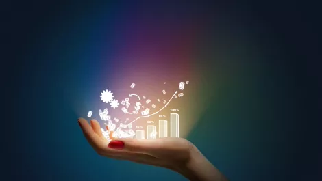 Hand holding rainbow